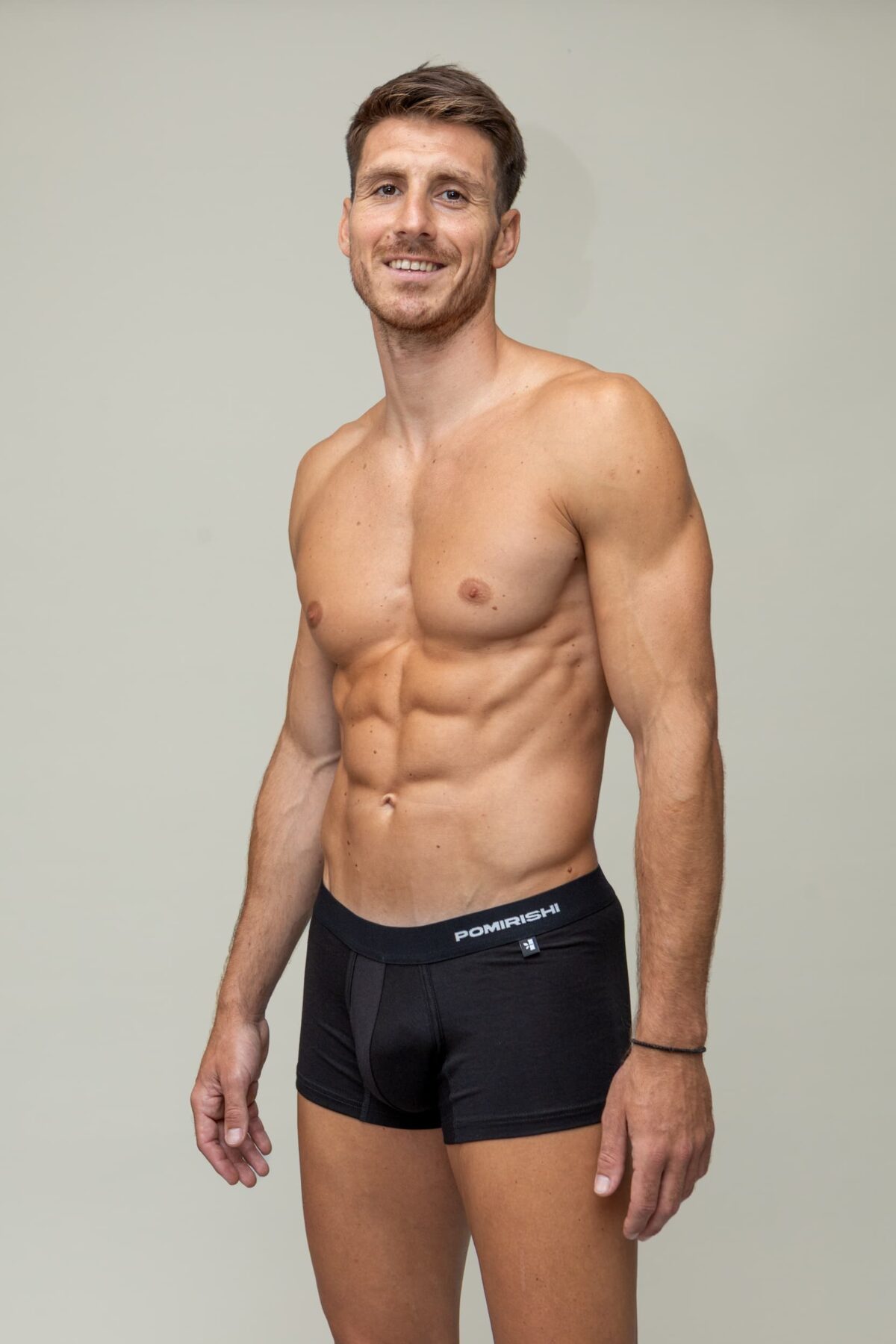 a man in black underwear briefs trunks